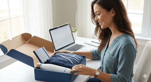 Woman Looking Into Box of Swag
